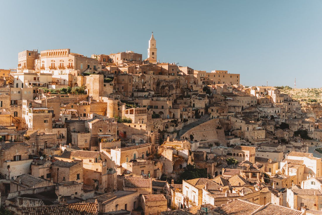 Best Italy Data eSIM: photo of a old Italy town on hillside under a blue sky.