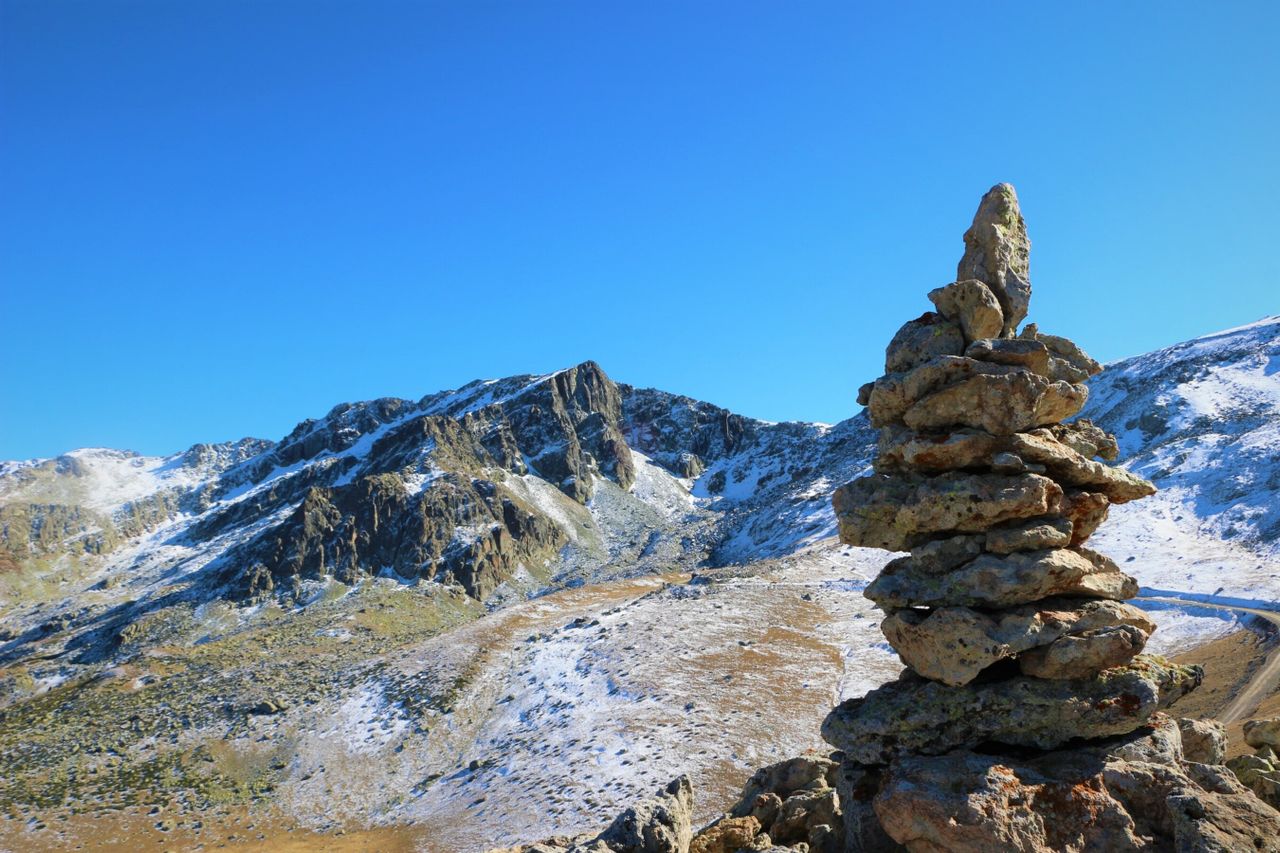 Best eSIM for Andorra - photo of mountain vista in Andorra with rock sculpture in the foreground