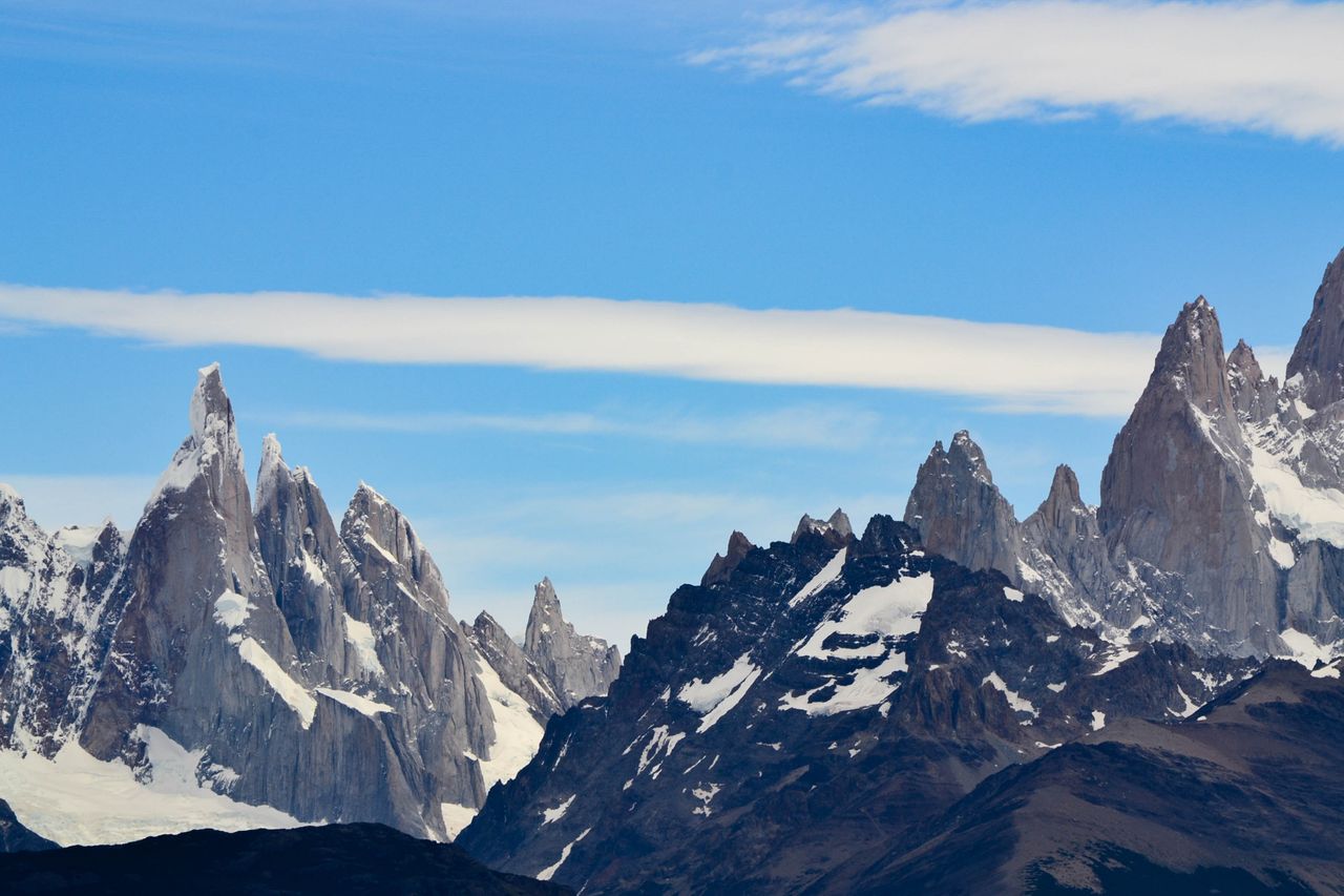 Best eSIM for Argentine; a scenic landscape photograph of jagged snow-dusted mountain peaks in Argentina.