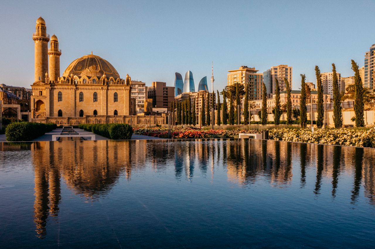 Best eSIM for Azerbaijan - photo of historic mosque in Azerbaijan with reflecting pool in the foreground.