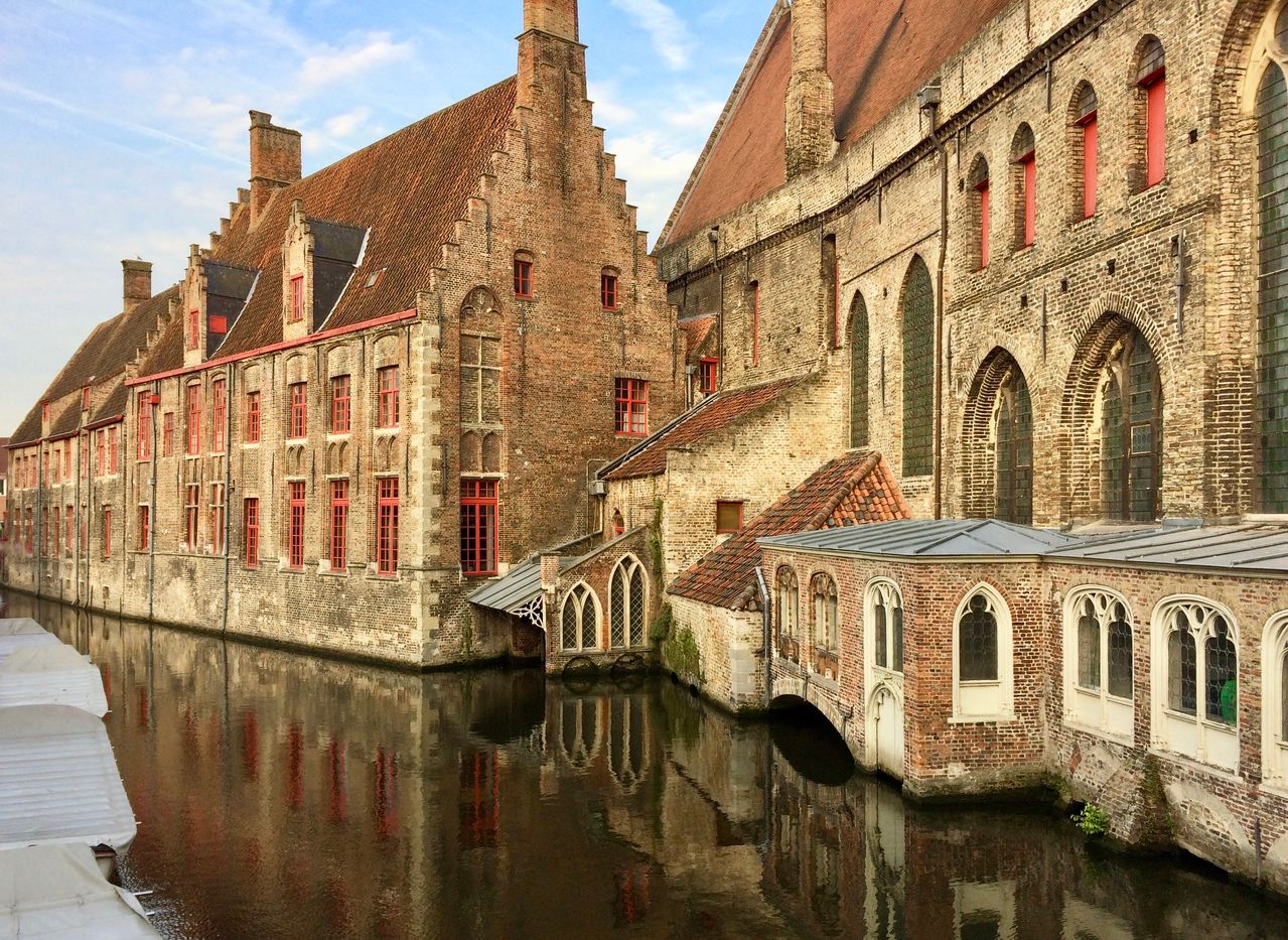 Best Belgium eSIM plan for travel - photo of historic building along a waterway in Belgium