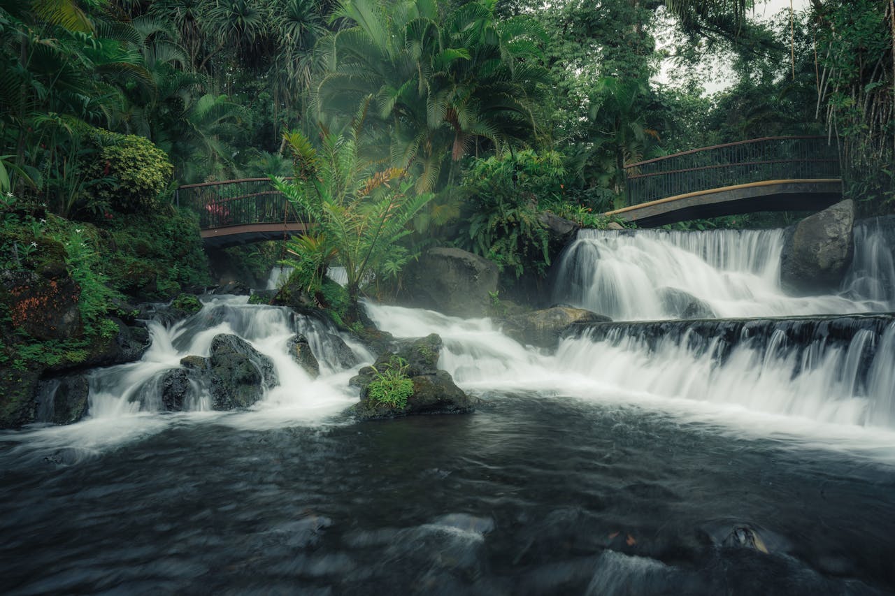 Costa Rica esim plans for travelers - photo of a river and waterfall in Costa Rican jungle.