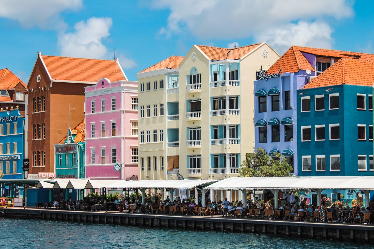 Best eSIM Curacao for travel - photo of colourful oceanfront buildings in Curacao