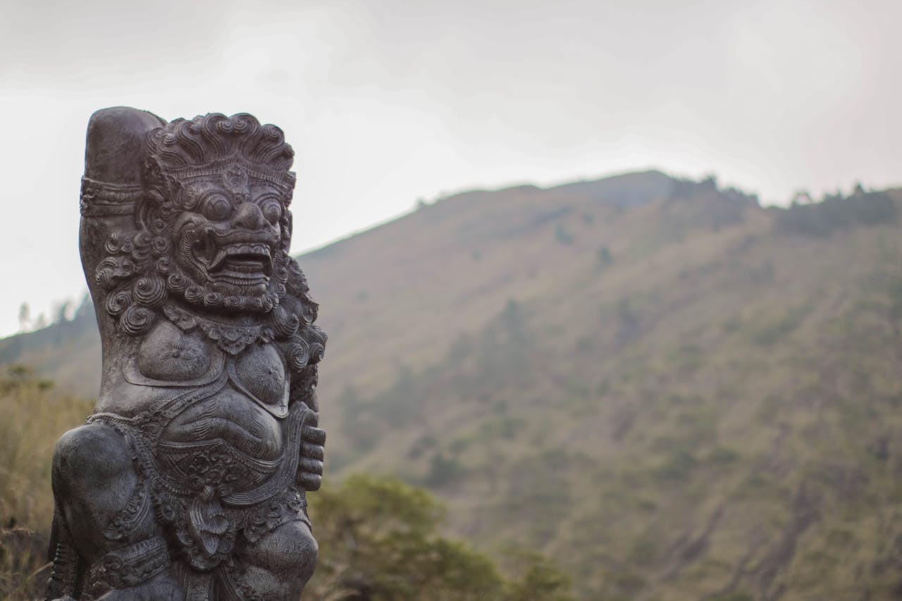 Indonesia eSIM plans for travel - photo of Indonesia statue with mountains in background