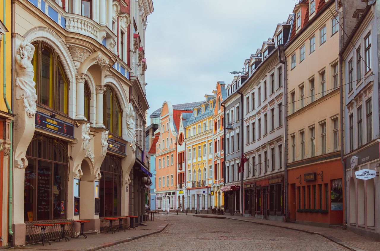 Best eSIM for Latvia travel - photo of historic buildings with cobblestone streets in Latvia.