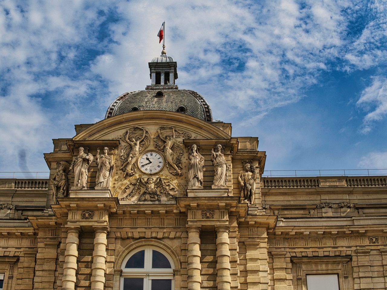 Best eSIM for Luxembourg - photo of historic building in Luxembourg under a partially cloudy blue sky