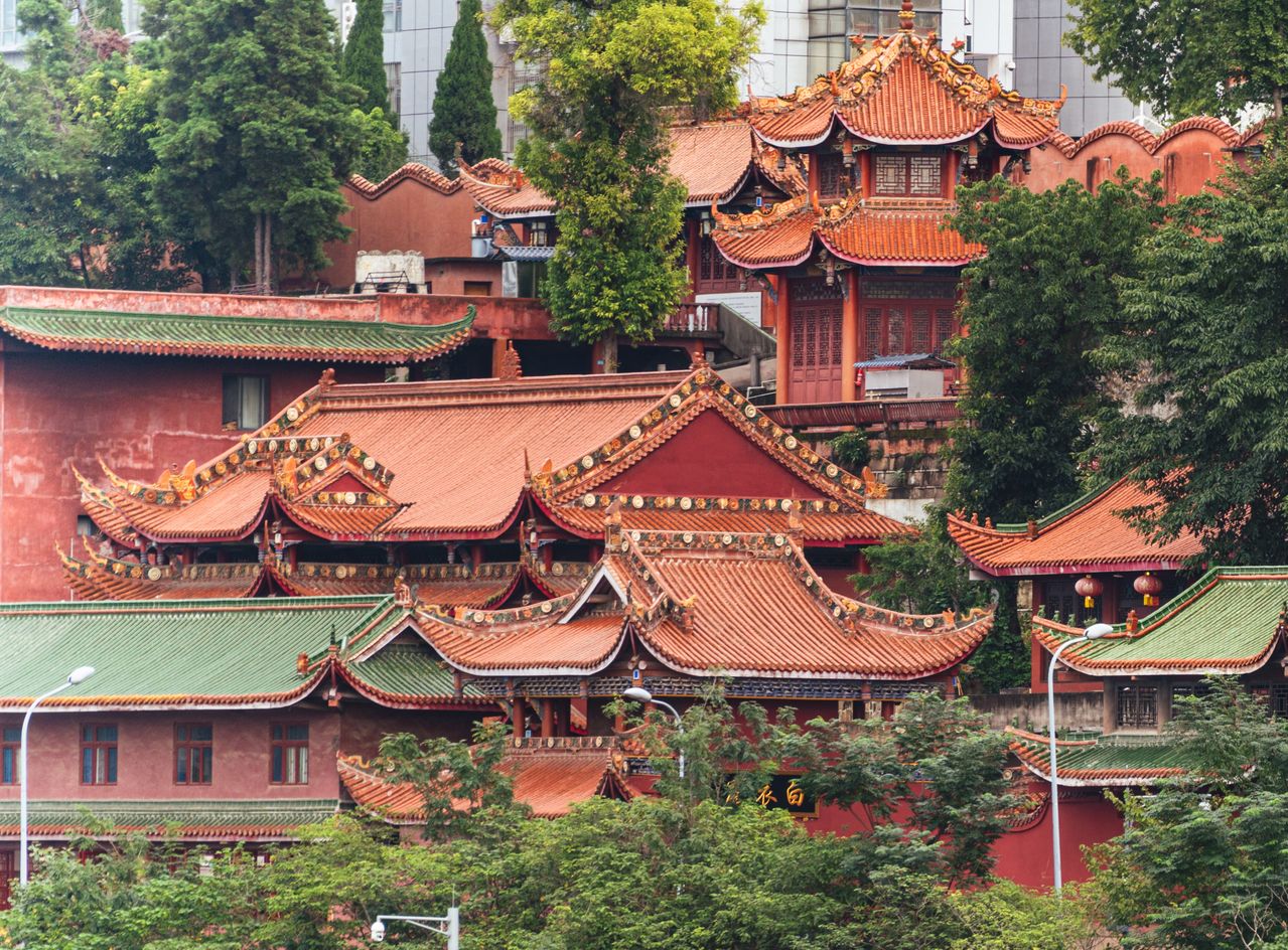 Best Macau eSIM for travel: a Traditional Chinese temple in Macau with red walls and orange-tiled roofs.