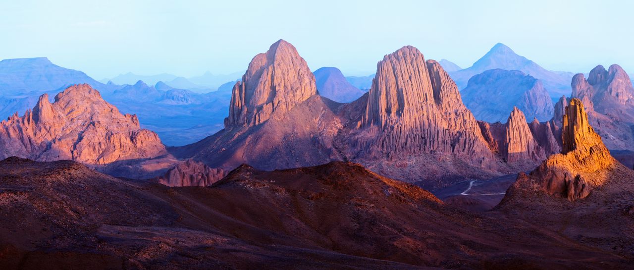 Best eSIM for Mali; scenic view of rugged mountains in Mali at sunset.