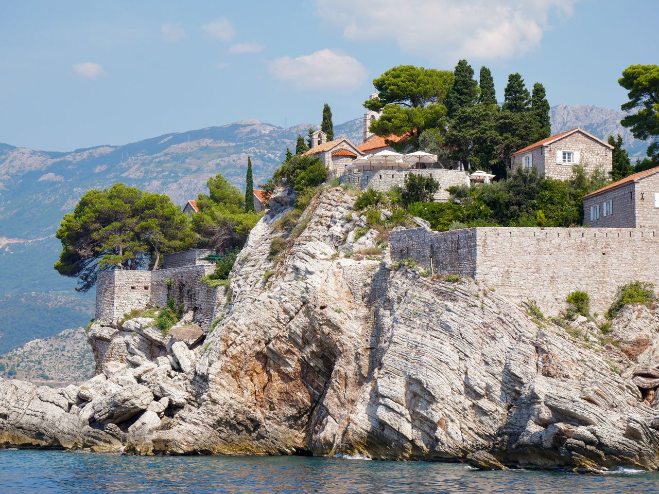 Best Montenegro eSIM plan for travel - photo of scenic cliffside community on the sea in Montenegro