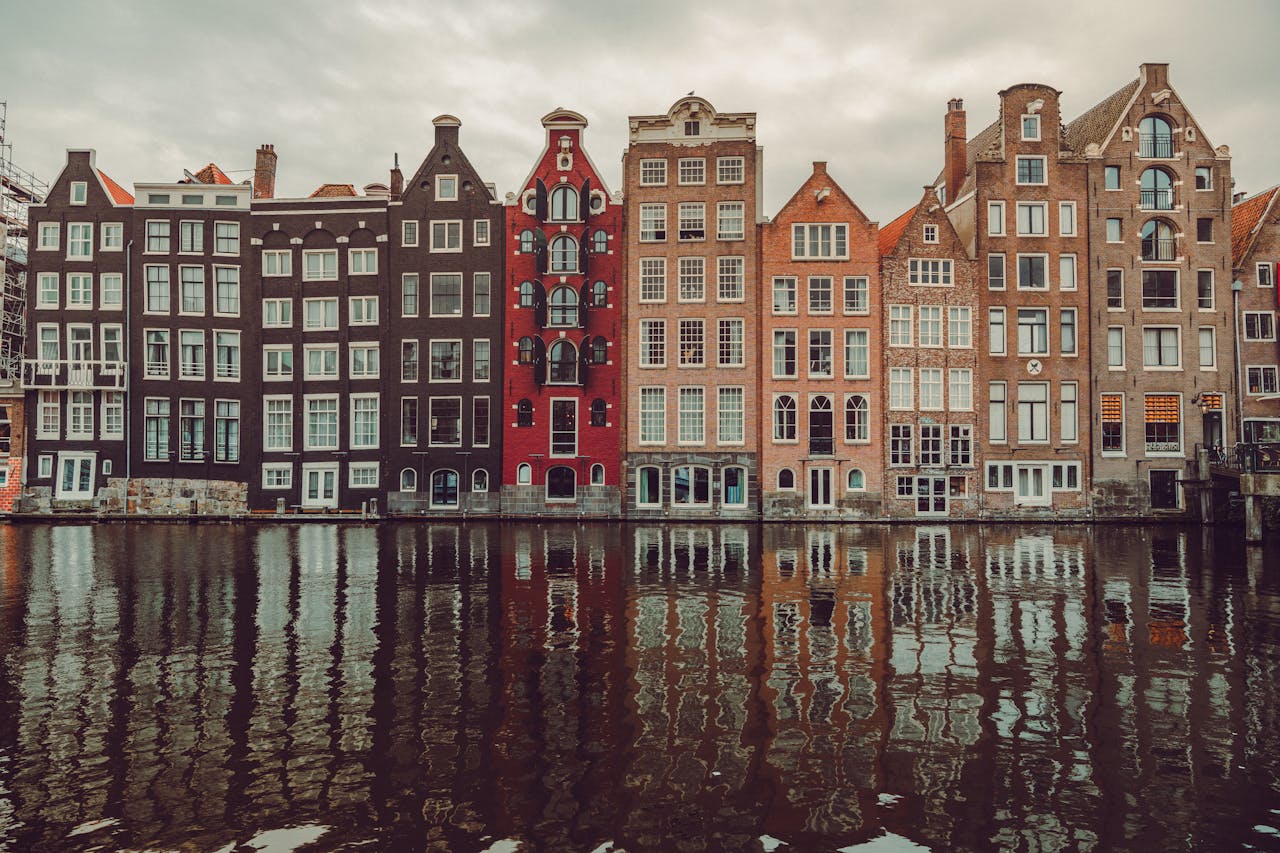 Netherlands esim plans for travel - photo of Netherlands buildings along a canal.