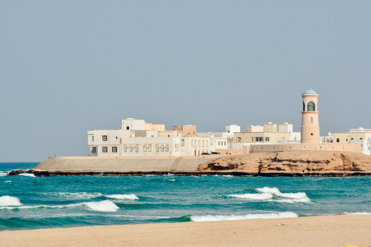 Best eSIM for Oman travel - photo of seaside houses along the Oman coastline