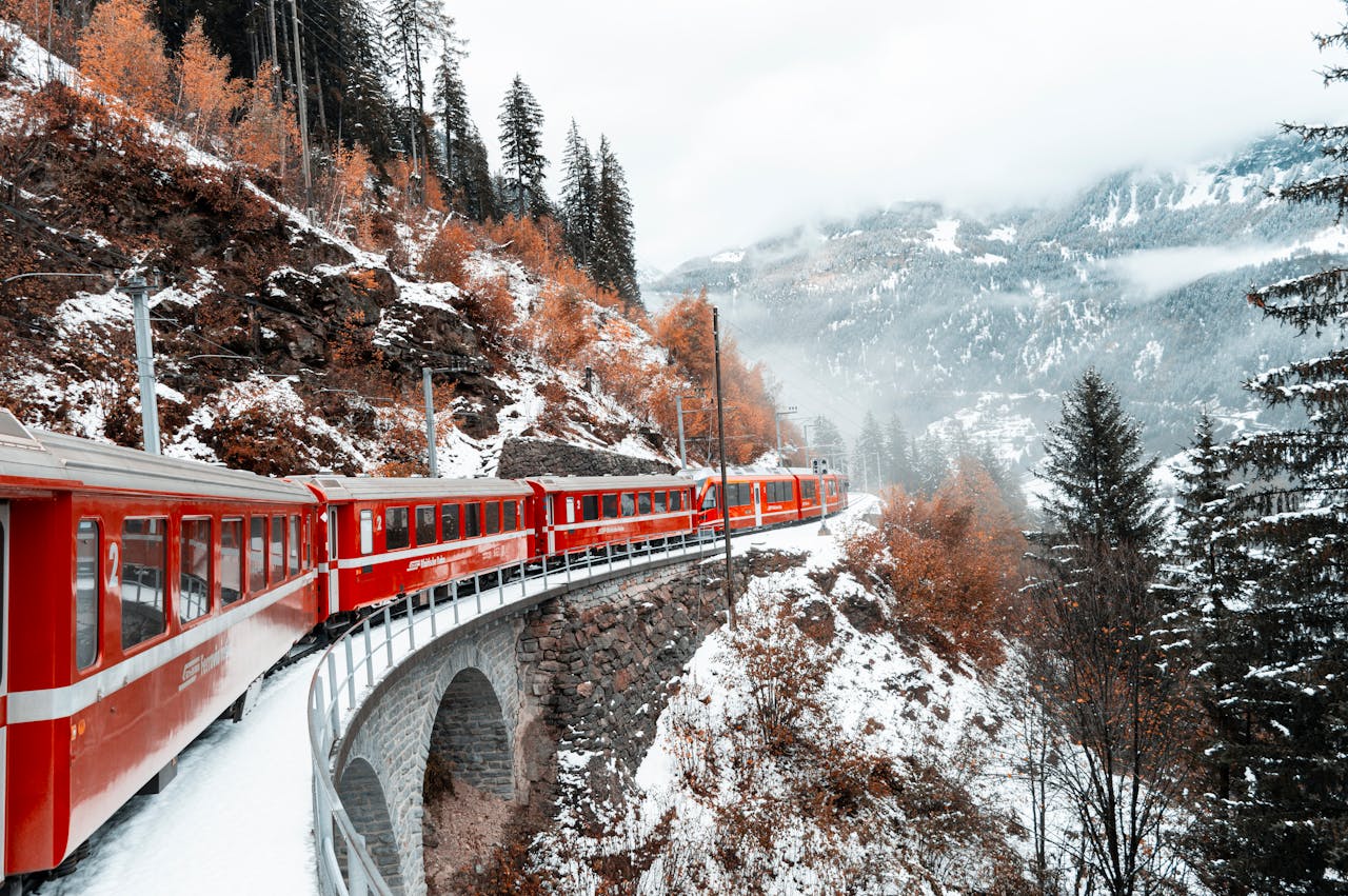 Switzerland esim plans for travel - photo of train going through the Swiss Alps