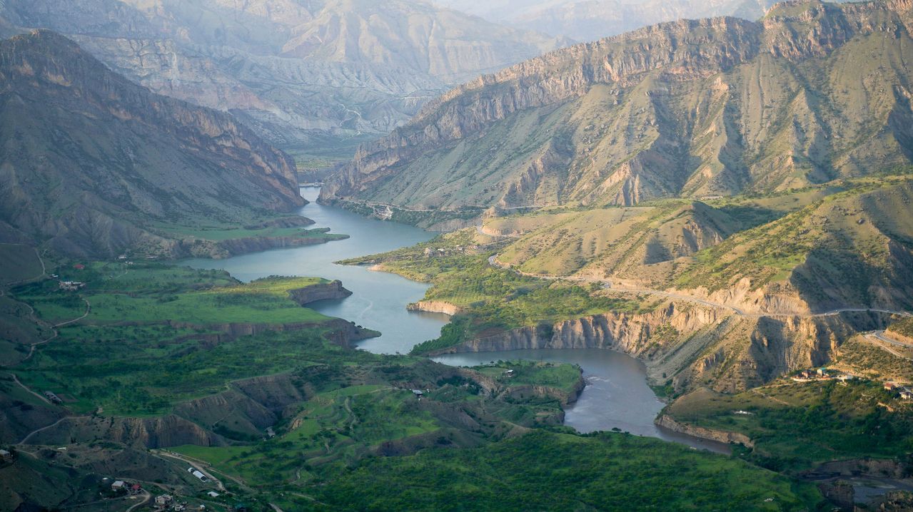 Best eSIM for Tajikistan; a winding river flowing through a deep mountain canyon in Tajikistan.